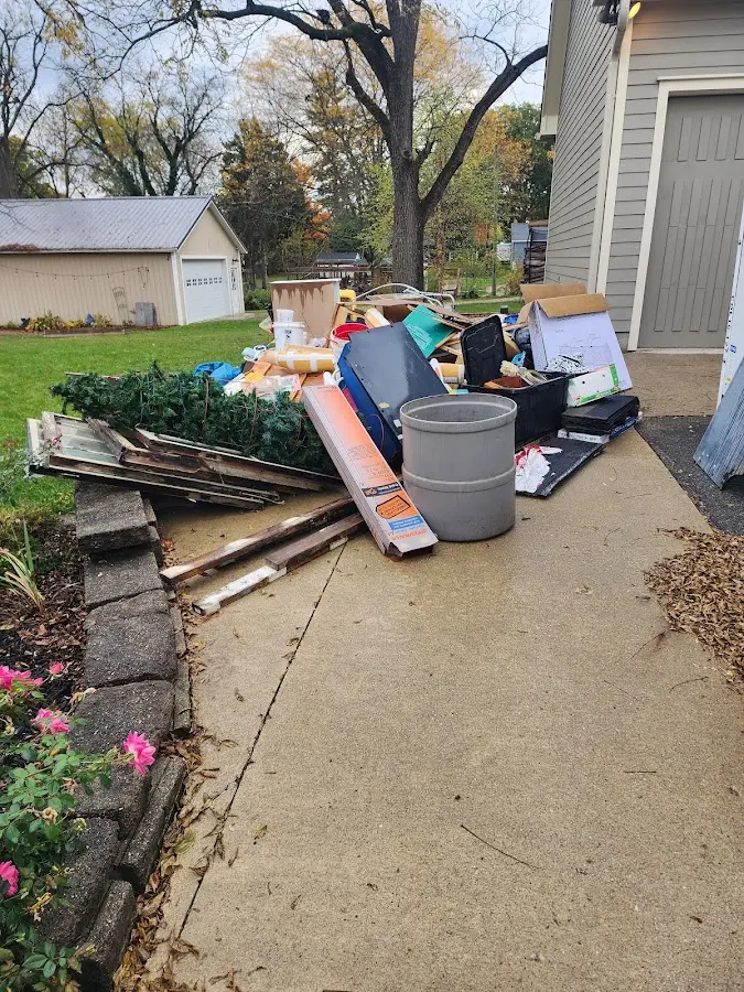 Dumpster being loaded with debris for 30 Yard Dumpster Rental in Donora
